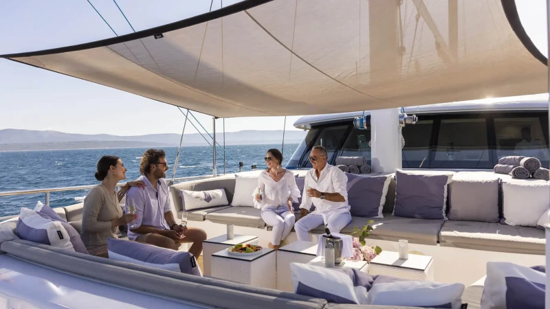 People drinking wine on Custom Line 143 yacht Aurum Sky yacht