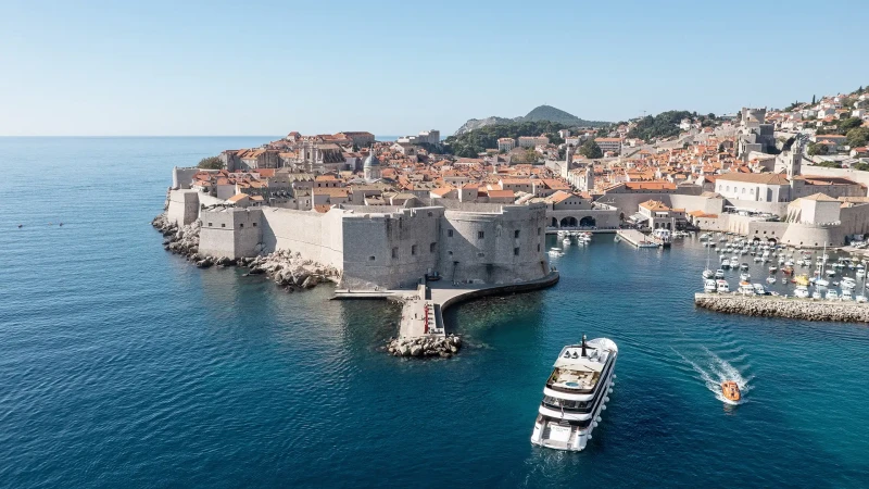 Custom-made Black Swan yacht entering Dubrovnik City port