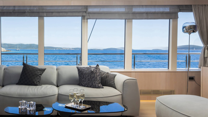 Bright and airy yacht lounge area with panoramic windows
