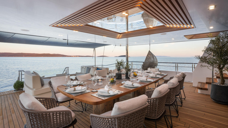 Elegant outdoor dining setup on a luxury yacht