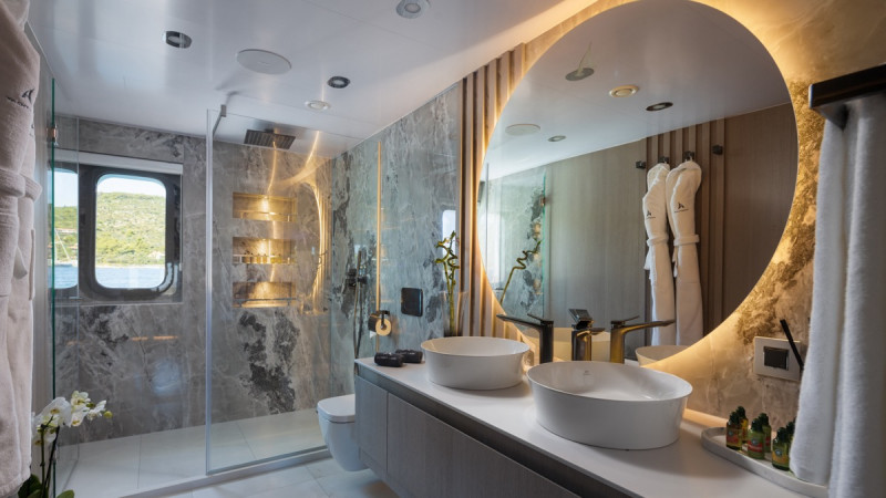 Modern yacht bathroom featuring dual showers